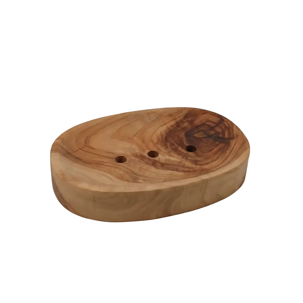 An oval wooden soap dish with three drainage holes, featuring natural wood grain patterns and a dark knot on the right side, set against a plain light gray background.