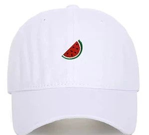 A white baseball cap featuring a small embroidered watermelon slice on the front, set against a plain white background.