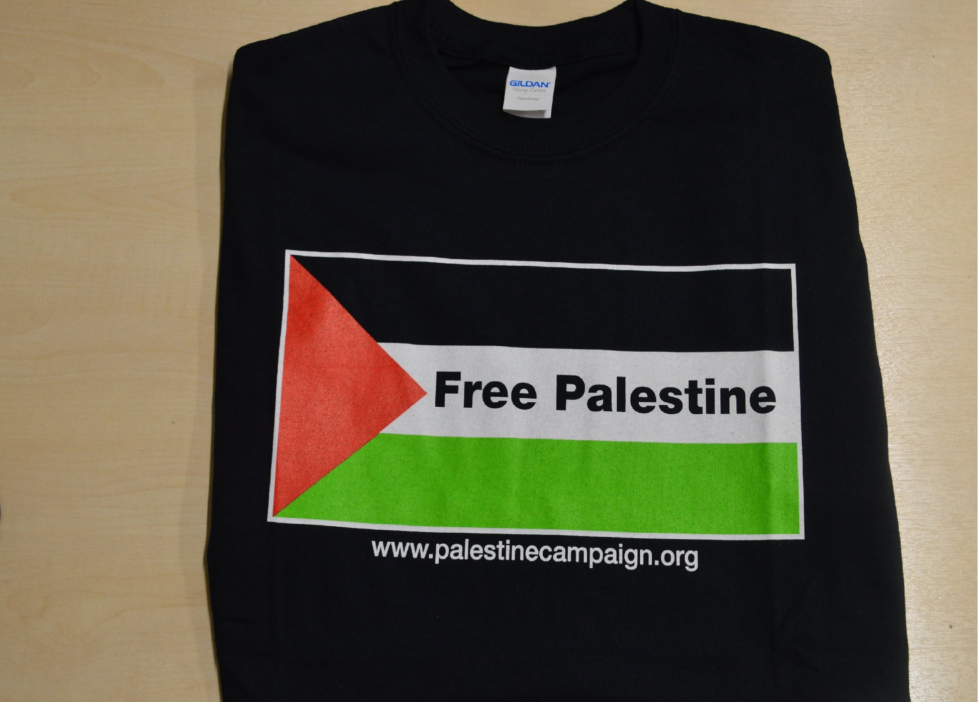 Black t-shirt with Palestinian flag. Writing says Free Palestine
